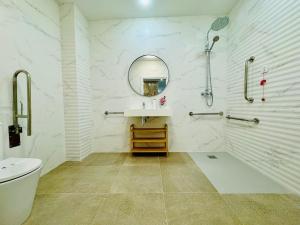 a bathroom with a sink and a shower and a mirror at LOFT 1 - Space & Conform Close To Center in Valencia