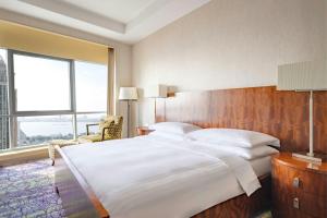 Postelja oz. postelje v sobi nastanitve Qabila Westbay Hotel