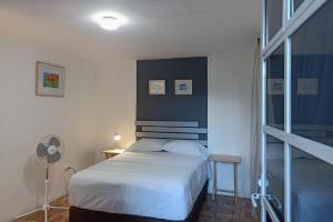 Ένα ή περισσότερα κρεβάτια σε δωμάτιο στο TR3S by Walter de la Renta