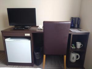 Kuchyň nebo kuchyňský kout v ubytování New Matto Terminal Hotel