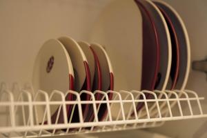 a group of dishes in a rack in a refrigerator at Elen Apartments in Ezermala