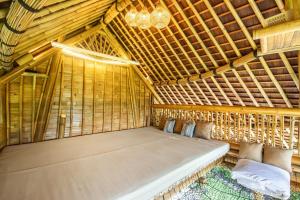 Postel nebo postele na pokoji v ubytování Aura Svarga - Swarga House