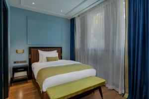 Cama ou camas em um quarto em LUME Boutique Hotel, Autograph Collection