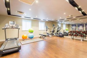 a gym with exercise equipment in a room at Courtyard by Marriott Glasgow Airport in Paisley