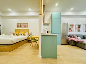 a bedroom with a bed and a couch and a table at LOFT 3 - Space & Conform Close To Center in Valencia