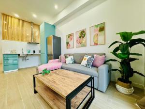 a living room with a couch and a table at LOFT 3 - Space & Conform Close To Center in Valencia