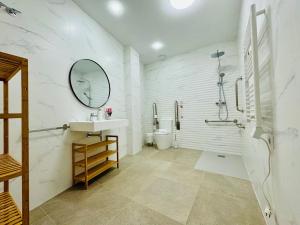 a bathroom with a sink and a shower and a toilet at LOFT 3 - Space & Conform Close To Center in Valencia