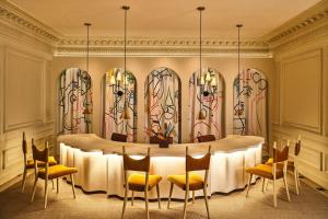 a conference room with a table and chairs at Hotel Per La, Autograph Collection in Los Angeles