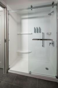 a shower with a glass door in a bathroom at Courtyard by Marriott Chicago Downtown/River North in Chicago