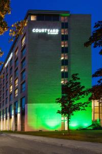 a building with a large advertisement on the side of it at Courtyard By Marriott Brussels in Brussels