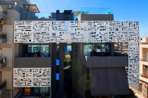 a building with a lot of squares on it at Athina Art Apartments in Athens