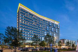 a tall building with a lot of windows at Aloft by Marriott Boston Seaport District in Boston