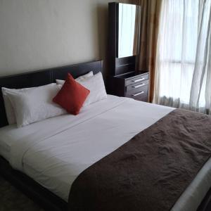 Postel nebo postele na pokoji v ubytování Fantastic appartment at times square Kuala Lumpur
