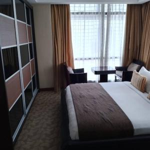 Postel nebo postele na pokoji v ubytování Fantastic appartment at times square Kuala Lumpur