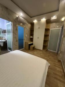 A bed or beds in a room at Vung Tau Villa mini sát biển - Gitico Homestay