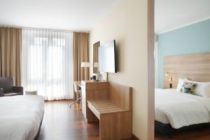 Postel nebo postele na pokoji v ubytování Courtyard by Marriott Dresden