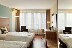 Postel nebo postele na pokoji v ubytování Courtyard by Marriott Dresden