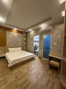 A bed or beds in a room at Vung Tau Villa mini sát biển - Gitico Homestay