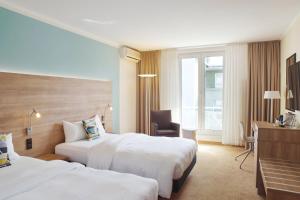 Postel nebo postele na pokoji v ubytování Courtyard by Marriott Dresden