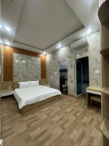 A bed or beds in a room at Vung Tau Villa mini sát biển - Gitico Homestay