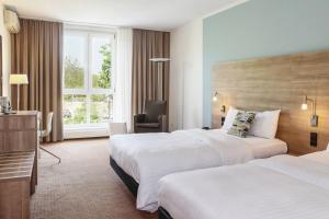 Postel nebo postele na pokoji v ubytování Courtyard by Marriott Dresden