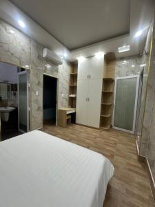 A bed or beds in a room at Vung Tau Villa mini sát biển - Gitico Homestay
