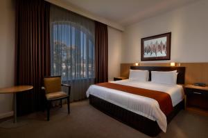 Postel nebo postele na pokoji v ubytování BEST WESTERN PLUS Travel Inn