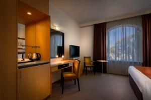 Postel nebo postele na pokoji v ubytování BEST WESTERN PLUS Travel Inn