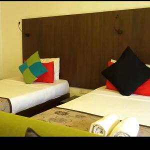Postel nebo postele na pokoji v ubytování Eeescart Family Resort