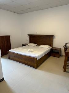 Postel nebo postele na pokoji v ubytování Sky Heaven Hotel