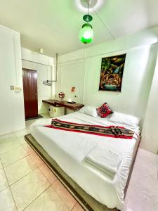 Postel nebo postele na pokoji v ubytování Sea Beach Paradise