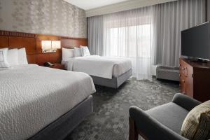 Ліжко або ліжка в номері Courtyard by Marriott Boulder