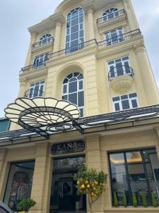 a building with a chandelier in front of it at Kana Boutique Hotel Ninh Bình in Ða Gia