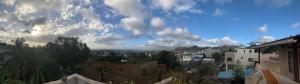 a view of a city under a cloudy sky at Luxurious house at Coromandel in La Rotraite