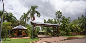 a gazebo in a park with palm trees at Ivanhoe Resort in Kununurra