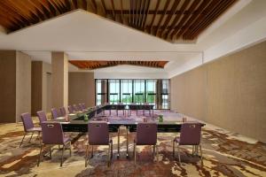 a large meeting room with a long table and chairs at Renaissance Bali Uluwatu Resort & Spa in Uluwatu +37 photos
