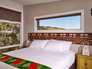 Giường trong phòng chung tại Panoramia Villas
