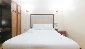 Postel nebo postele na pokoji v ubytování Bliss Hotel Dau
