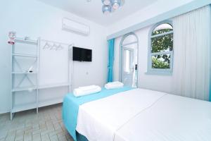Postel nebo postele na pokoji v ubytování Kemer Royal Beach