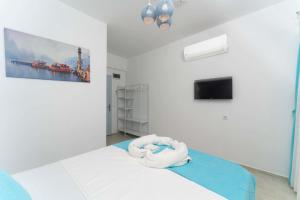 Postel nebo postele na pokoji v ubytování Kemer Royal Beach