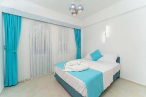Postel nebo postele na pokoji v ubytování Kemer Royal Beach