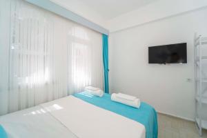 Postel nebo postele na pokoji v ubytování Kemer Royal Beach