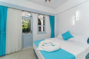Postel nebo postele na pokoji v ubytování Kemer Royal Beach