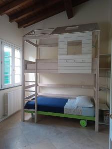 a bunk bed in a room with a bunk bedscribed at House in the convent in Chiavari