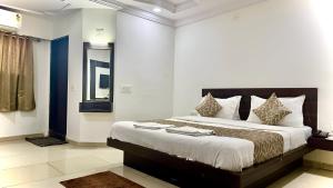 Katil atau katil-katil dalam bilik di Hotel Dev Palace