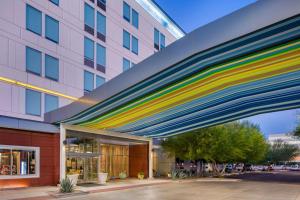 a building with colorful streaks of paint on it at Aloft Phoenix Airport in Phoenix