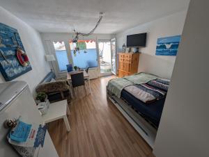 TV a/nebo společenská místnost v ubytování Allgäu Ankerplatz mit Sauna und Pool