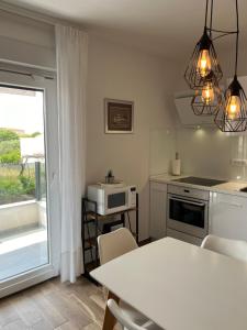Kuchyň nebo kuchyňský kout v ubytování LUXURY Apartment Ledo