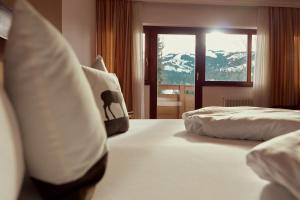 Posteľ alebo postele v izbe v ubytovaní Parkhotel Kirchberg
