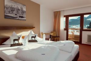 Posteľ alebo postele v izbe v ubytovaní Parkhotel Kirchberg